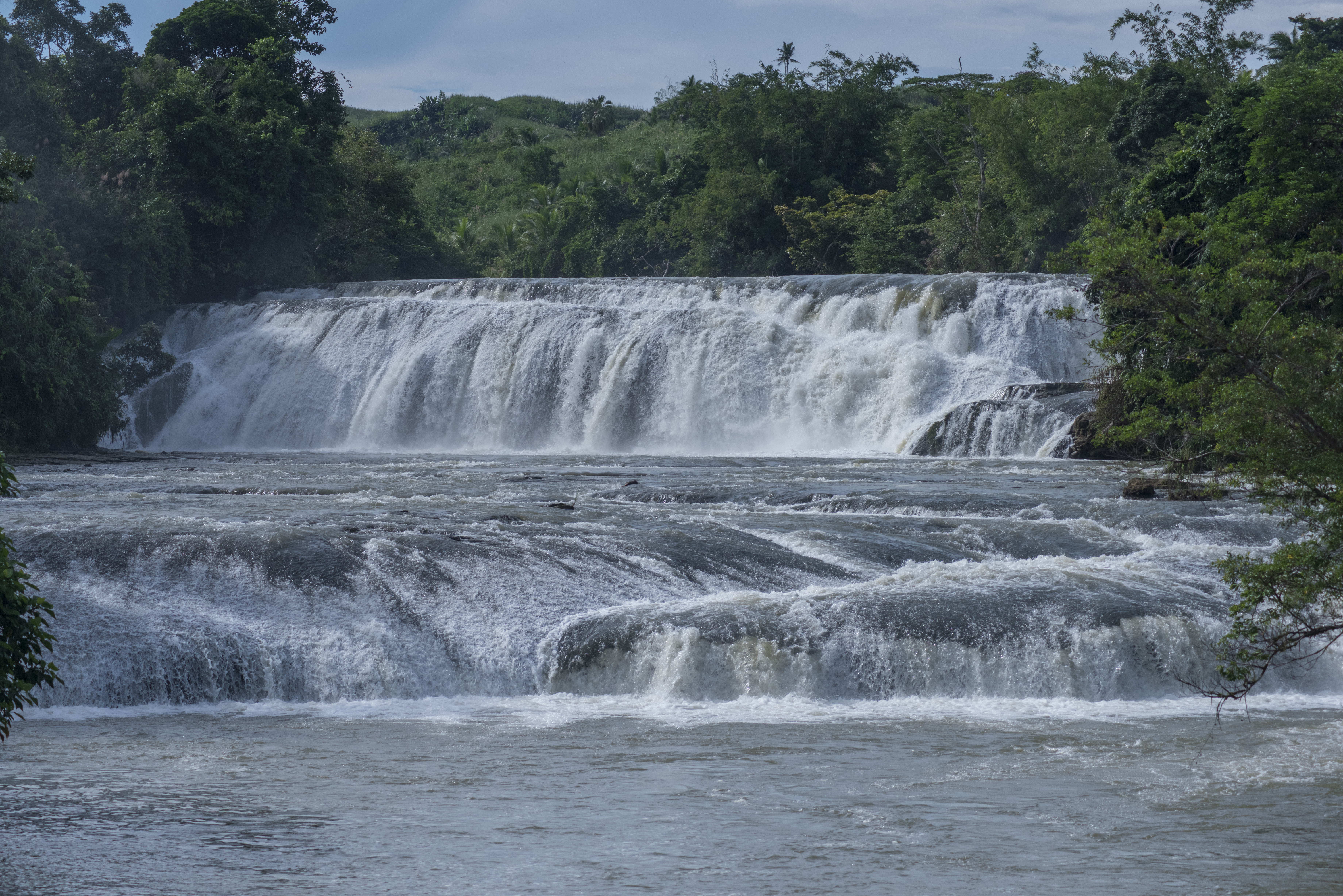 Lulugayan Falls — a multi-tiered waterfall cascading through the lush rainforest of Samar
